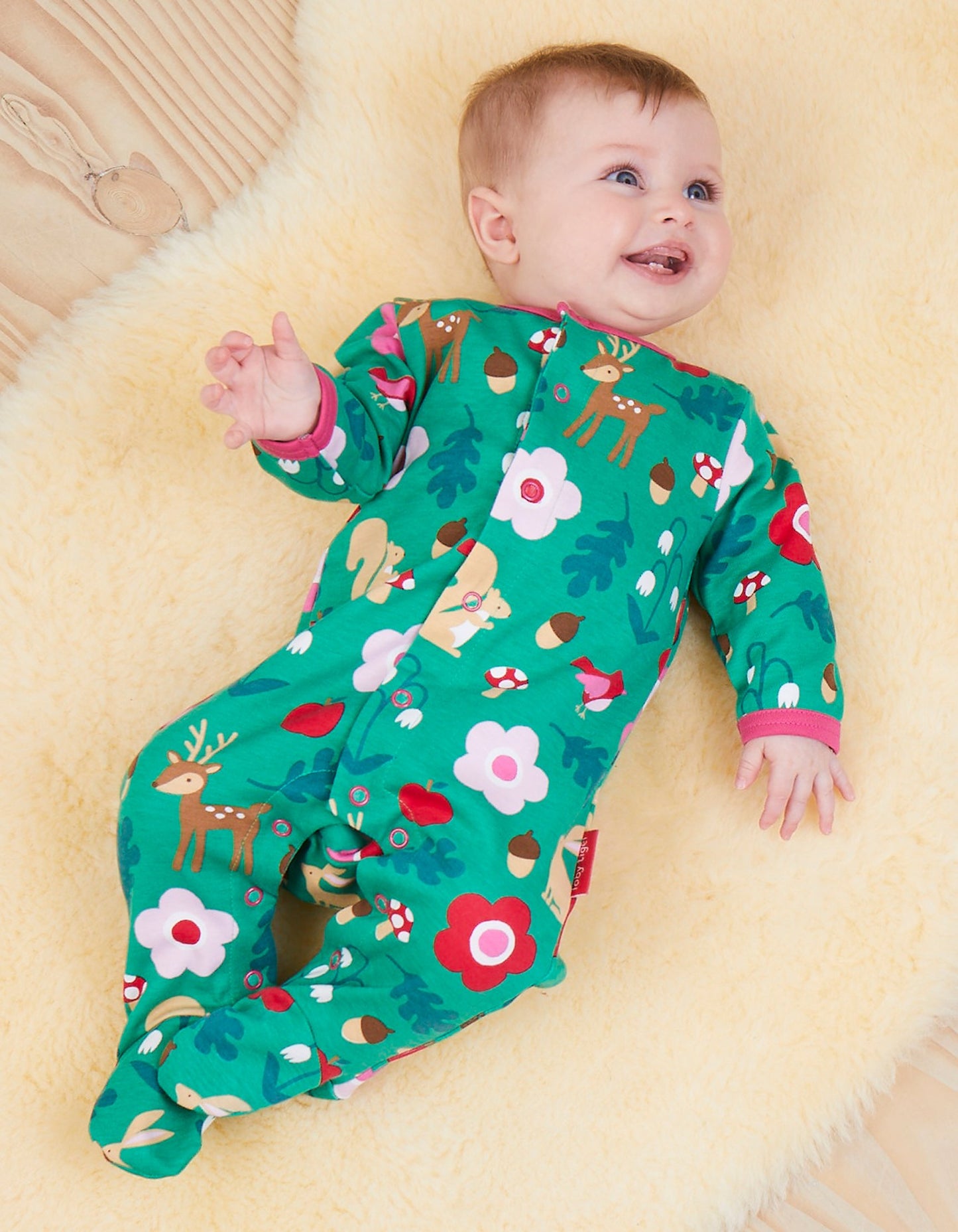 Pajamas with forest print made from organic cotton, closed feet